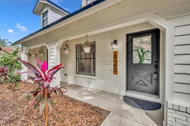 entrance to property with a porch