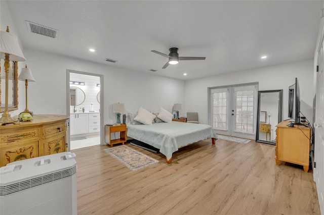 bedroom with ensuite bath, ceiling fan, french doors, access to exterior, and light hardwood / wood-style floors