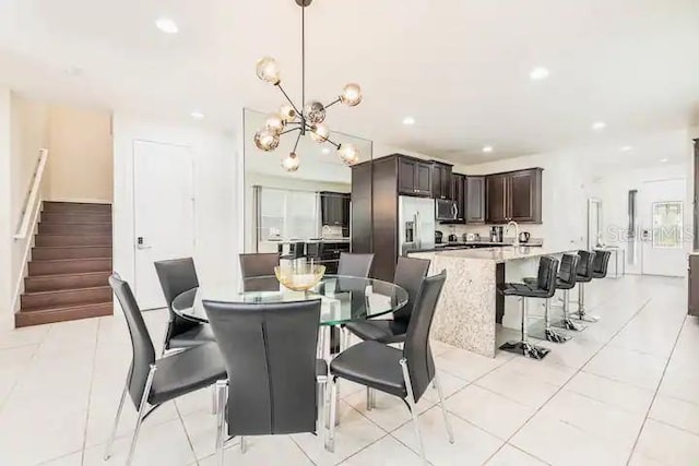 tiled dining area with an inviting chandelier