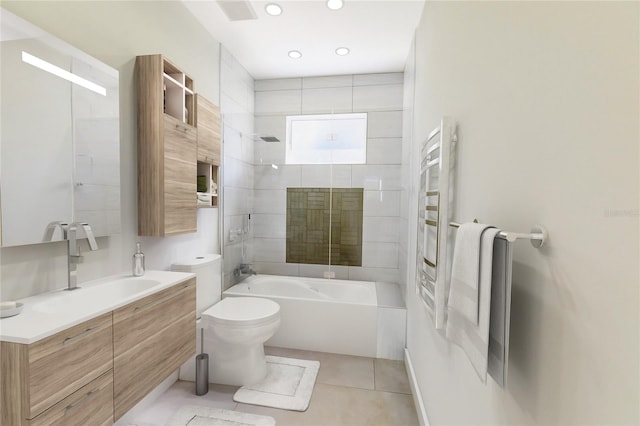 full bathroom with tile patterned floors, tiled shower / bath combo, vanity, and toilet