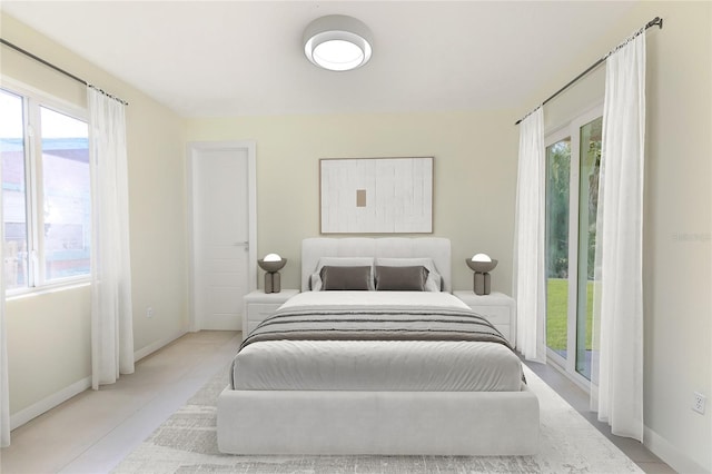 bedroom with light tile patterned flooring and access to exterior