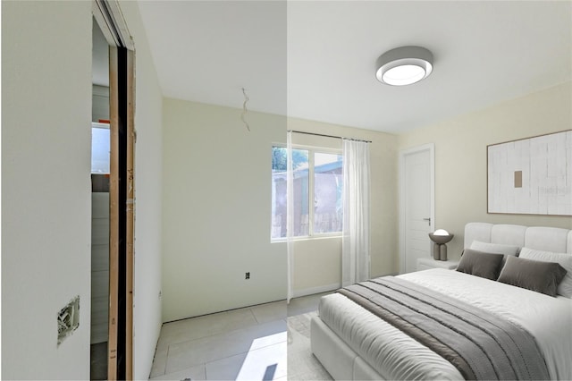 bedroom featuring light tile patterned flooring