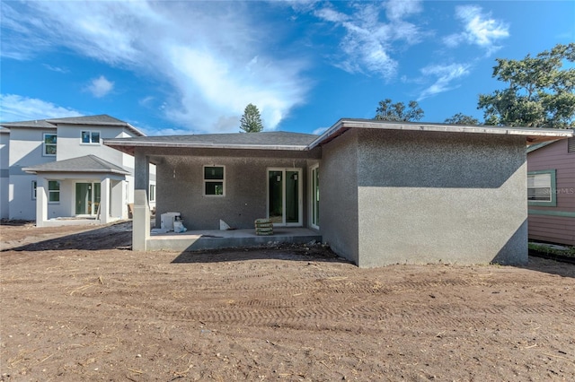 back of house with a patio area