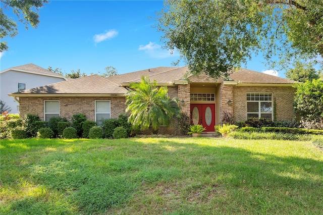 ranch-style house featuring a front yard