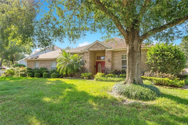 1434 Hidden Meadow Way, Apopka, FL 32712 - ranch-style house featuring brick siding, a shingled roof, and a front lawn