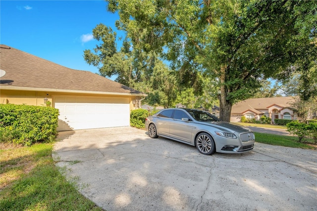 view of side of property with a garage