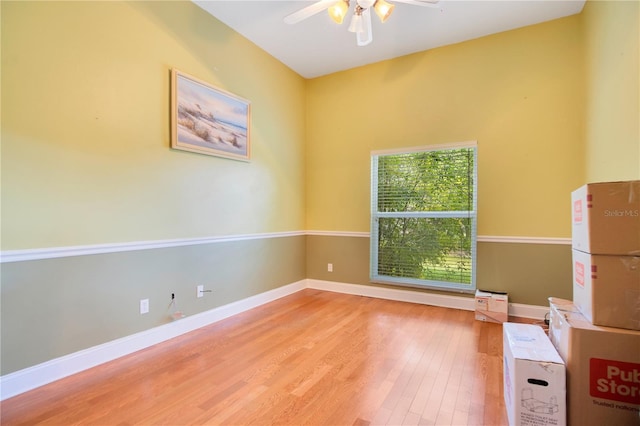 unfurnished room featuring ceiling fan and hardwood / wood-style flooring