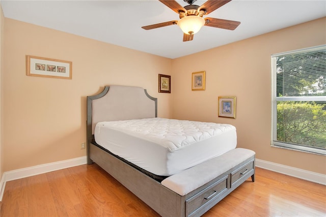 bedroom with light wood-type flooring and ceiling fan