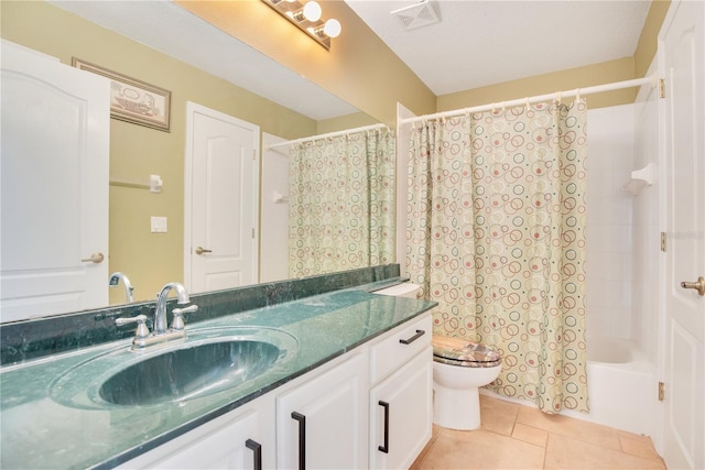 full bathroom featuring vanity, toilet, shower / bath combo, a textured ceiling, and tile patterned flooring