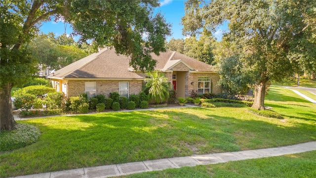 1434 Hidden Meadow Way, Apopka, FL 32712 - single story home featuring brick siding, a front lawn, and roof with shingles