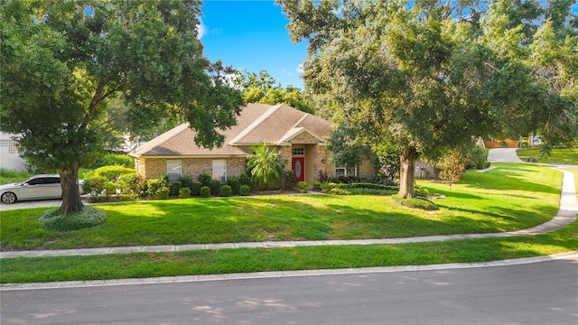 1434 Hidden Meadow Way, Apopka, FL 32712 - obstructed view of property featuring brick siding and a front yard