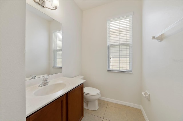 bathroom featuring vanity, tile patterned flooring, and toilet