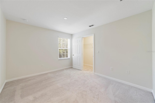 empty room with light colored carpet