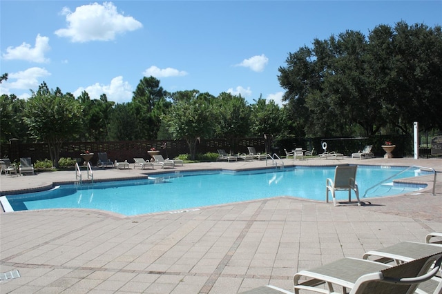 view of swimming pool featuring a patio