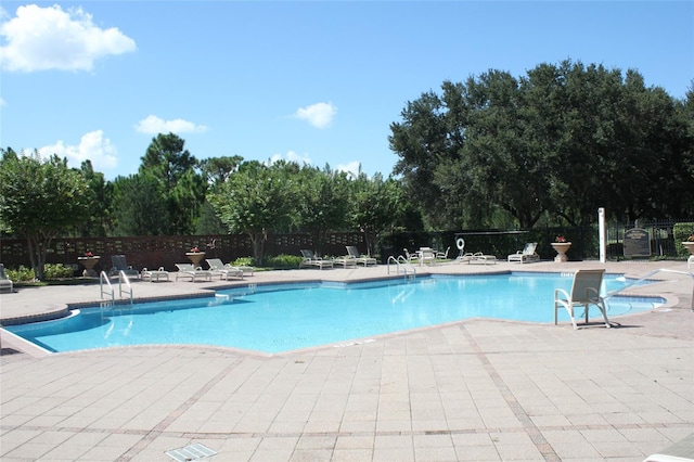 view of swimming pool featuring a patio