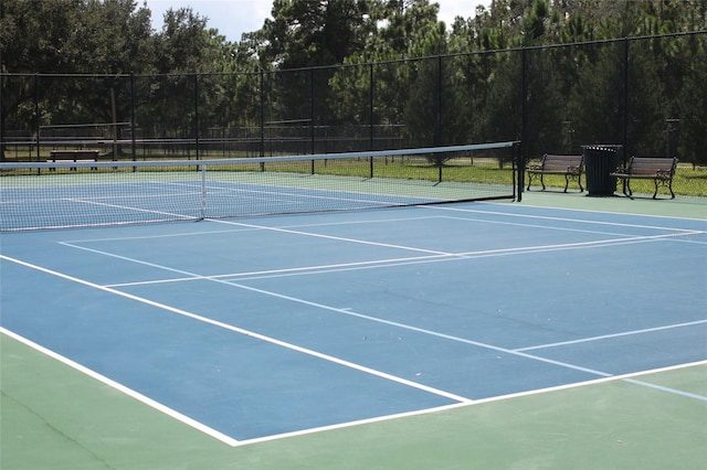 view of sport court featuring basketball hoop