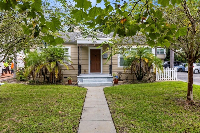 bungalow with a front lawn