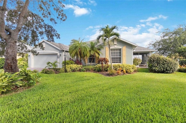 single story home with a garage and a front lawn