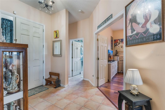 2366 Prairie Dunes, Clermont, FL 34711 - entrance foyer with a chandelier, baseboards, and light tile patterned flooring