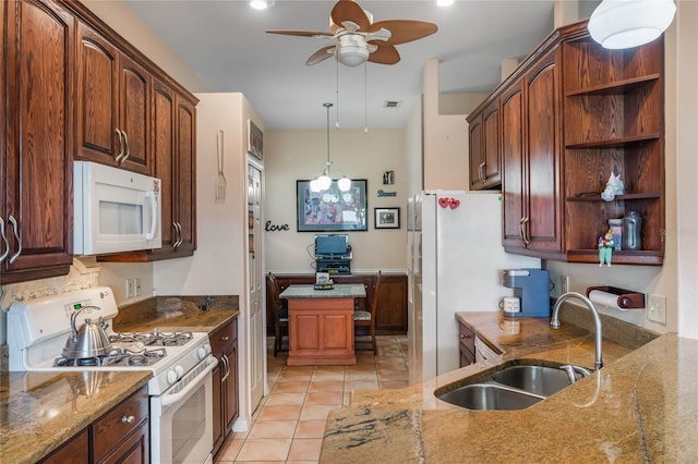 2366 Prairie Dunes, Clermont, FL 34711 - kitchen with stone counters, white appliances, ceiling fan, a sink, and open shelves