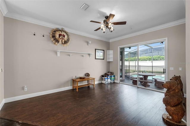 interior space featuring ceiling fan, crown molding, and dark wood-type flooring