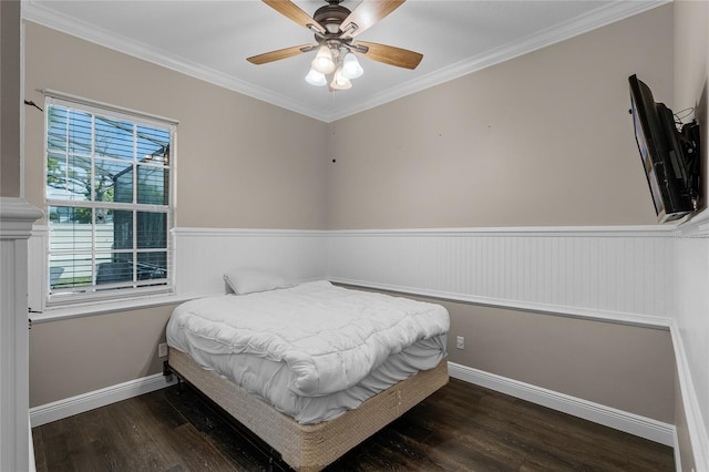 bedroom with ornamental molding, dark hardwood / wood-style flooring, and ceiling fan