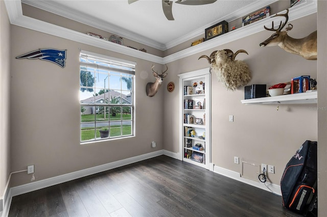 interior space featuring ornamental molding, dark hardwood / wood-style flooring, and ceiling fan