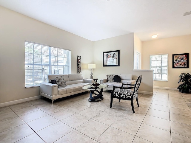 living room with light tile patterned flooring and a wealth of natural light