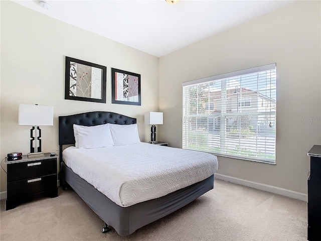 bedroom with light carpet