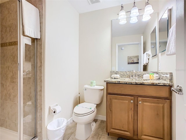 bathroom featuring walk in shower, tile patterned flooring, vanity, and toilet