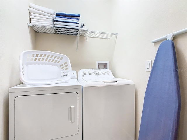 washroom with washer and dryer