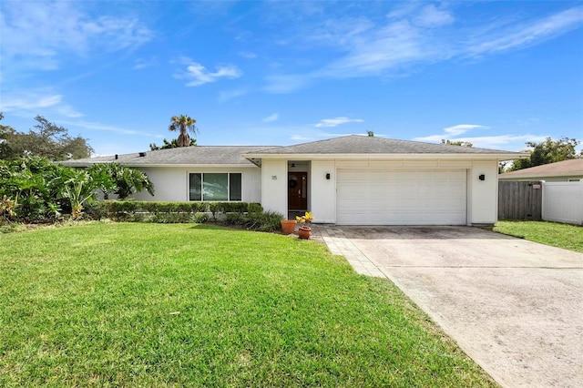 ranch-style house with a front yard and a garage