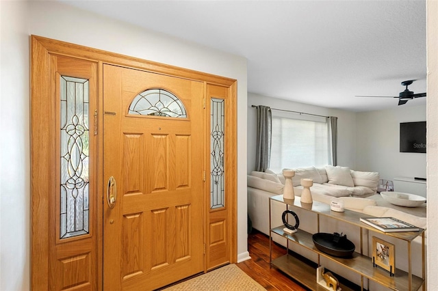 entryway with ceiling fan and hardwood / wood-style flooring