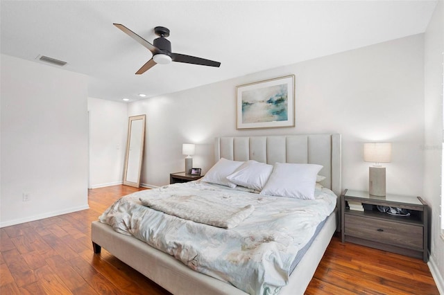 bedroom with ceiling fan and hardwood / wood-style flooring