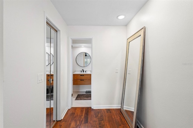 115 Marcy Blvd, Longwood, FL 32750 - hallway featuring dark wood-style floors, baseboards, and a sink