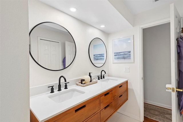 bathroom featuring hardwood / wood-style floors and vanity