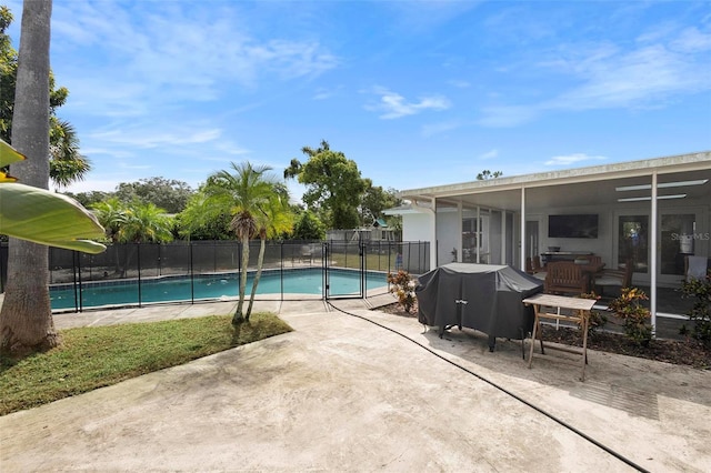 view of swimming pool featuring a patio and area for grilling