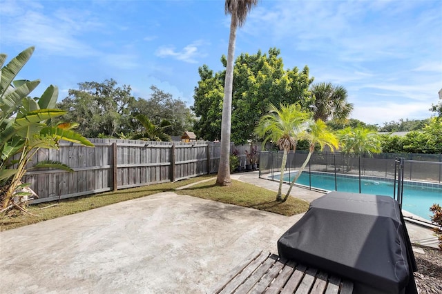 view of patio / terrace featuring a fenced in pool