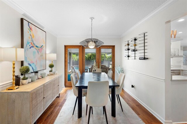 115 Marcy Blvd, Longwood, FL 32750 - dining room with french doors, crown molding, baseboards, and wood finished floors