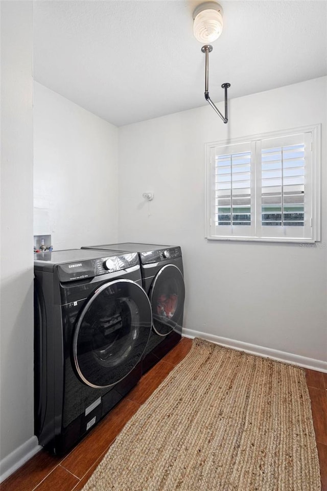 115 Marcy Blvd, Longwood, FL 32750 - washroom featuring baseboards, washing machine and dryer, laundry area, and dark wood-type flooring