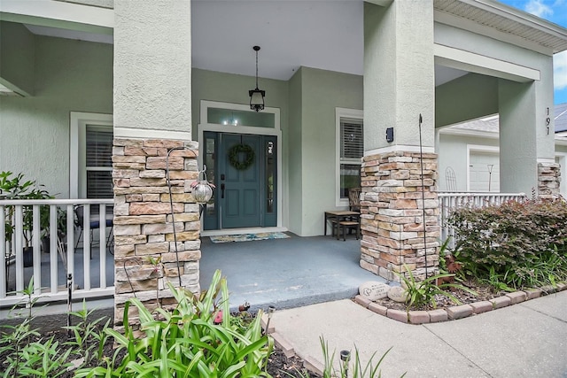 property entrance featuring covered porch