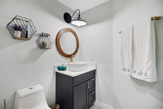 bathroom featuring vanity and toilet