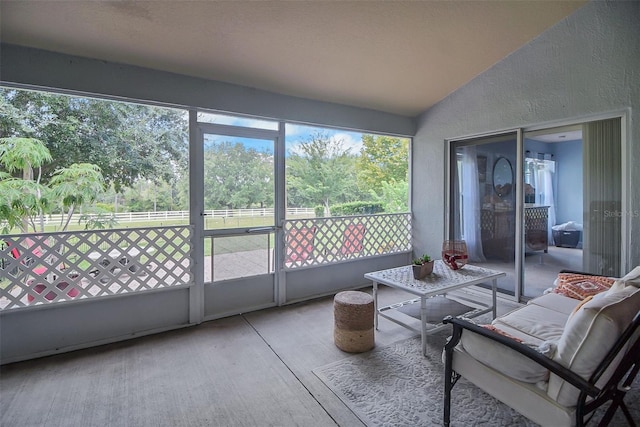 sunroom / solarium with vaulted ceiling