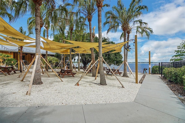 view of jungle gym featuring a water view