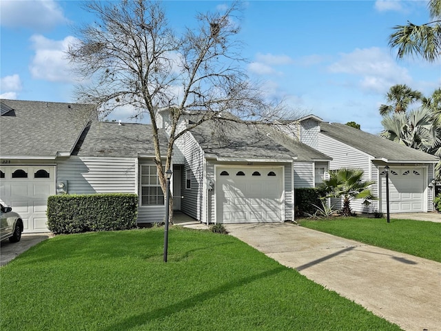 view of front facade featuring a garage and a front lawn