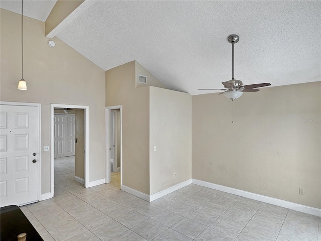 unfurnished room featuring high vaulted ceiling, ceiling fan, light tile patterned flooring, and a textured ceiling