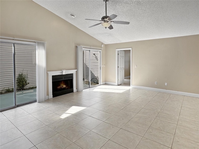 unfurnished living room featuring a textured ceiling, light tile patterned floors, ceiling fan, and high vaulted ceiling