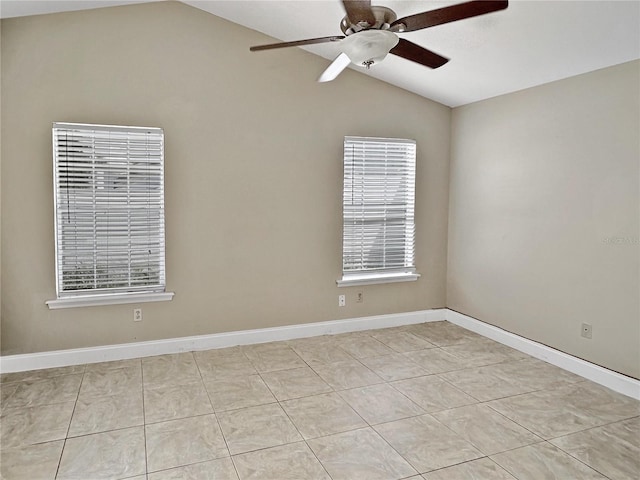 tiled spare room featuring ceiling fan and vaulted ceiling