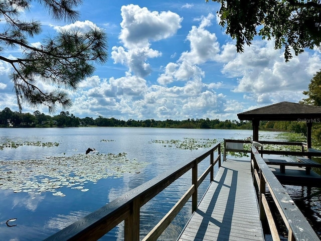 dock area featuring a gazebo and a water view