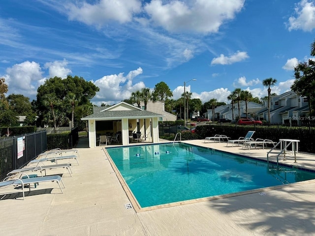 view of swimming pool with a patio area